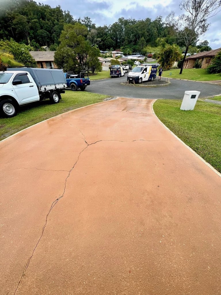 Cracked concrete driveway in rural area